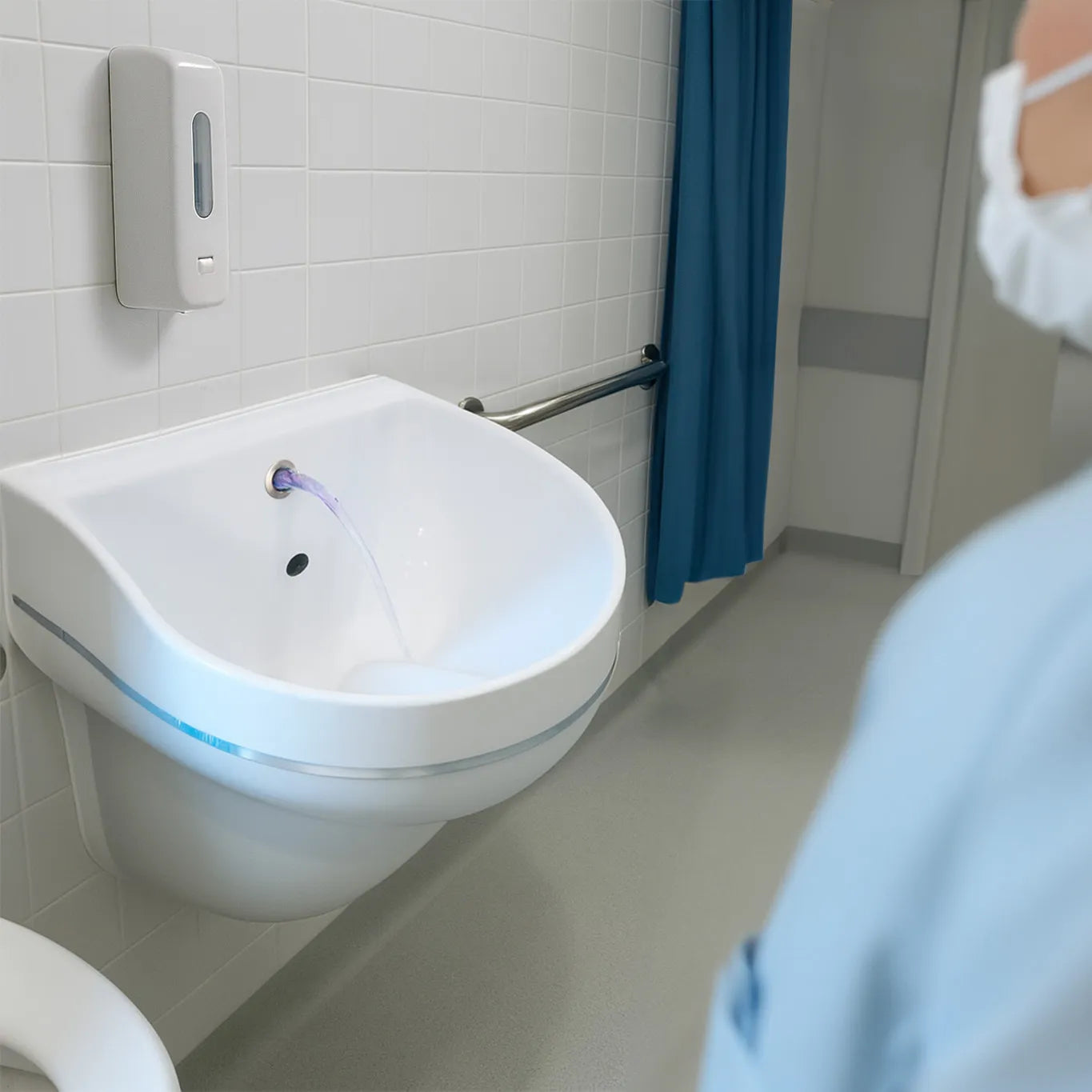 SmartFLO₃ self-disinfecting hospital sink with integrated UV-C light, designed to prevent biofilm buildup and reduce infection risk in healthcare environments.