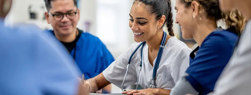 Healthcare professionals in training, representing Prescientx’s commitment to comprehensive operational and safety instruction for clinical and environmental staff.