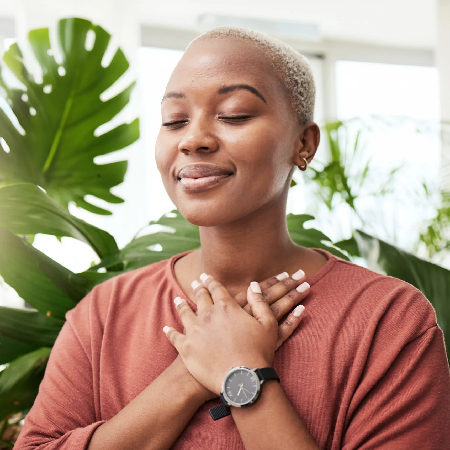 Woman breathing comfortably in a clean indoor environment, symbolizing the benefits of Prescientx continuous air disinfection.